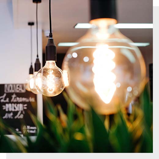 A string of lightbulbs in a coffee shop